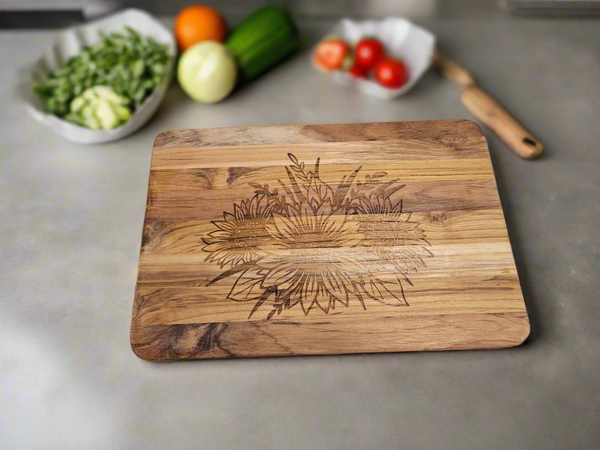 Wooden cutting board with engraved design on a patterned fabric background