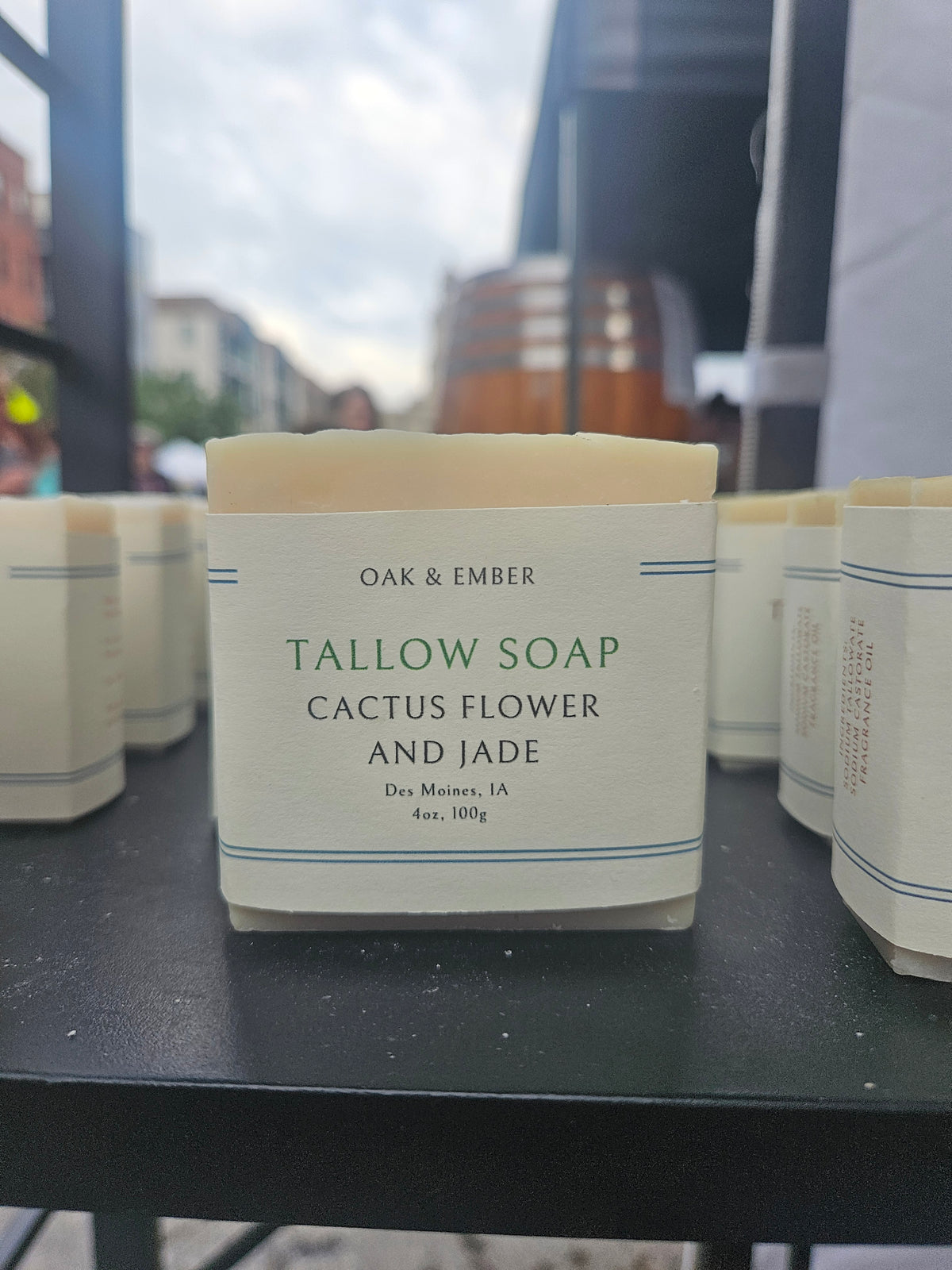 Bar of soap with 'Oak & Ember' branding on a black surface