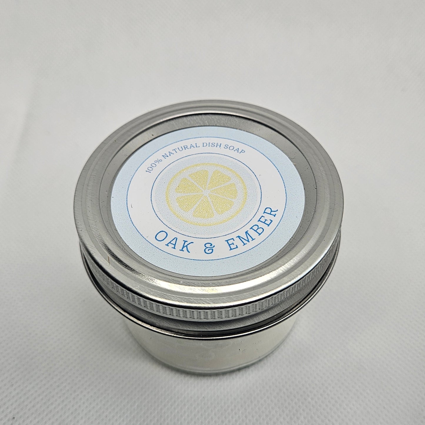Metallic container with a label on a white background