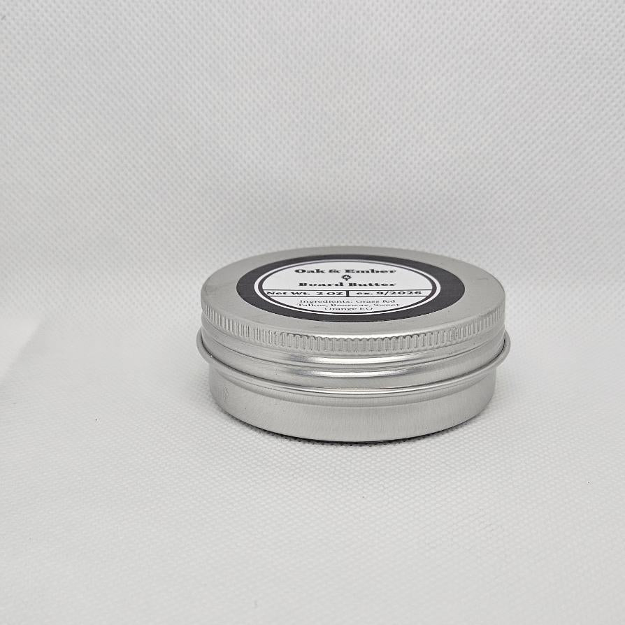 Silver metal tin with a black label on a white background