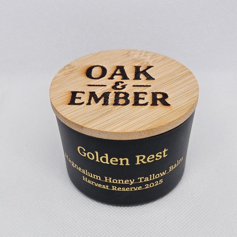 Balm container with wooden lid labeled 'Oak & Ember' on a gray background
