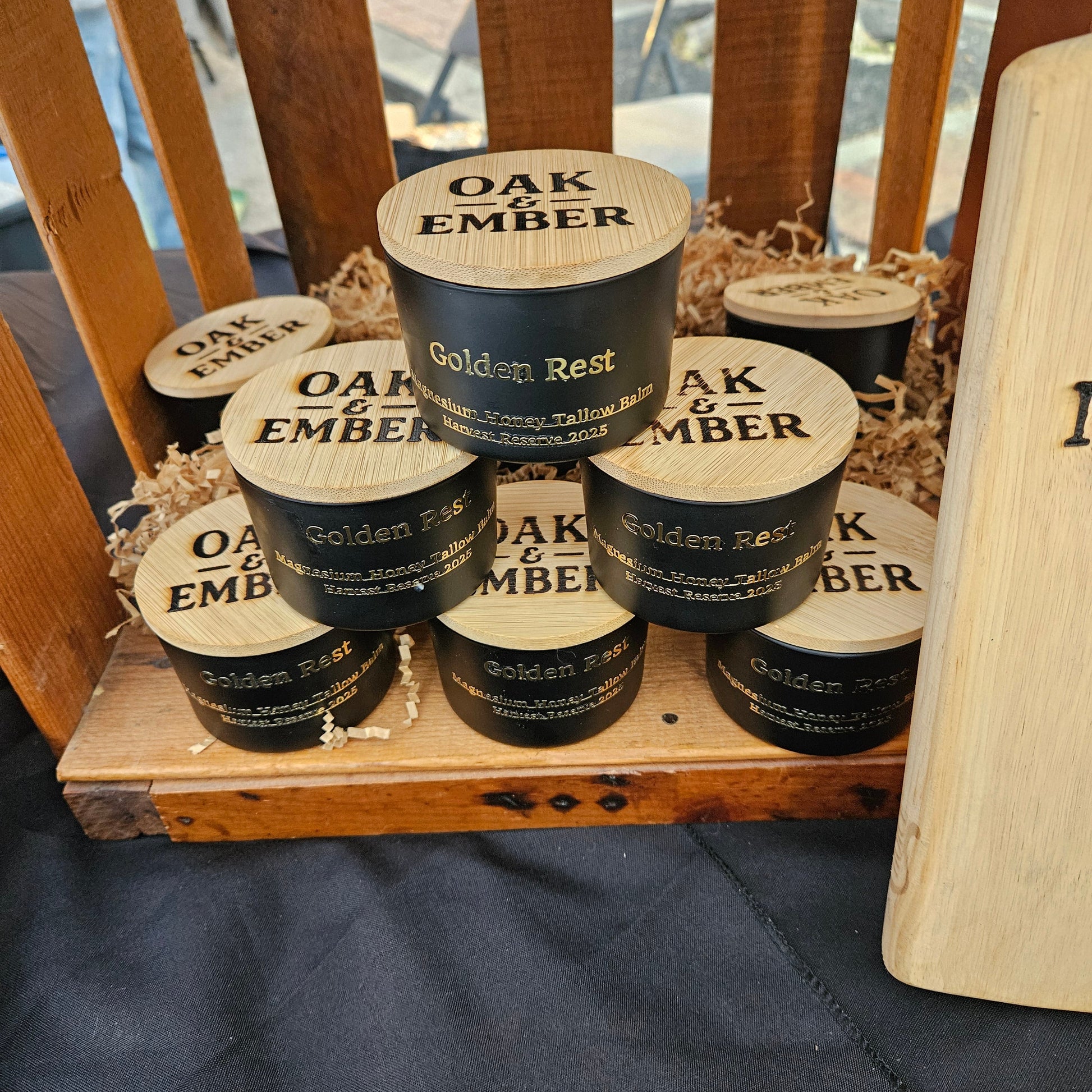 Wooden crate with bottles labeled 'Oak Ember' on a wooden surface.