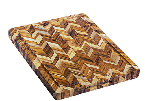 Wooden cutting board with a herringbone pattern on a white background