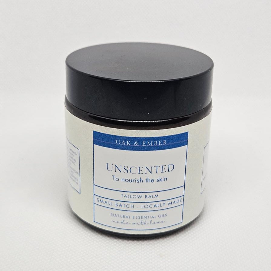 Jar of unscented balm with a black lid on a white background