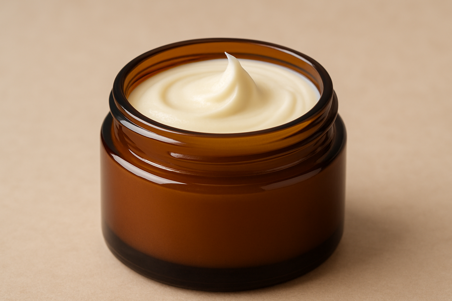 a jar of creamy tallow balm, in a brown amber jar, there is no lid. 