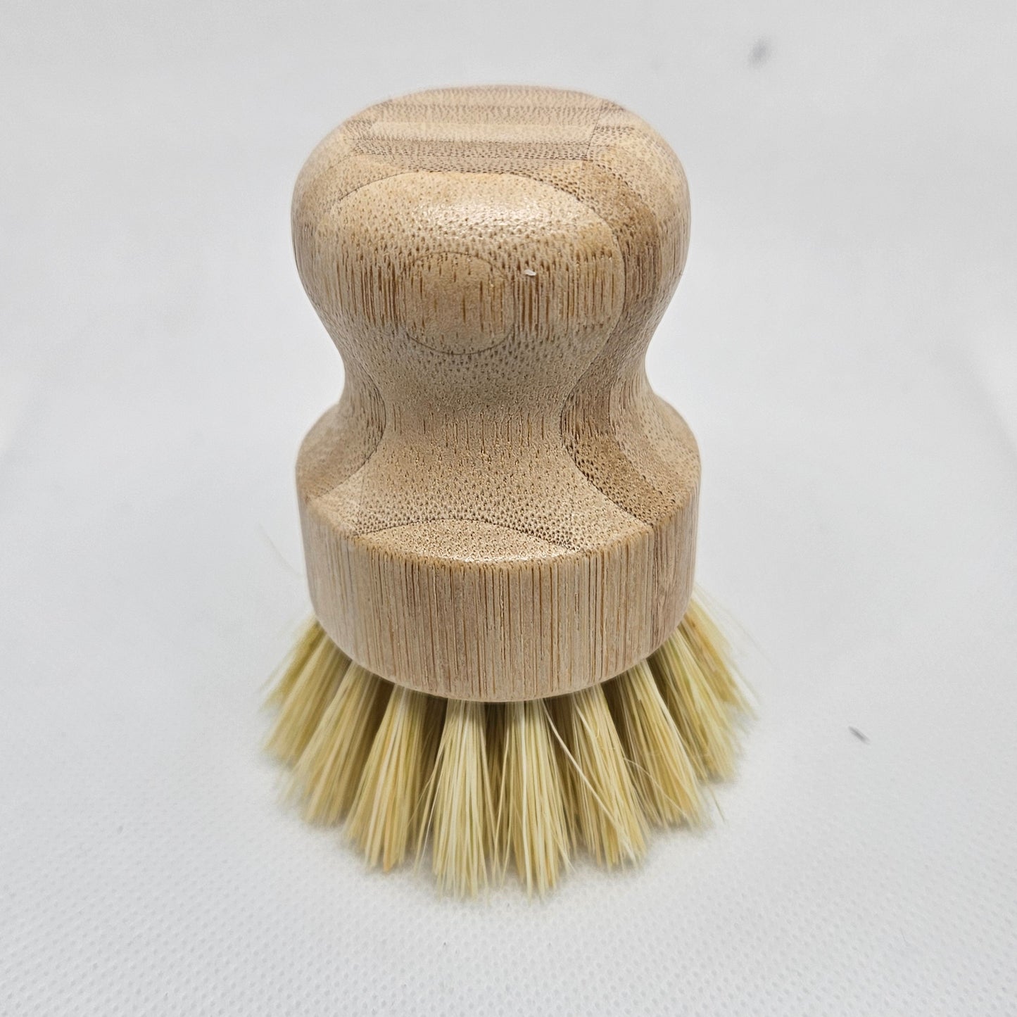 Wooden brush with bristle head on a white background