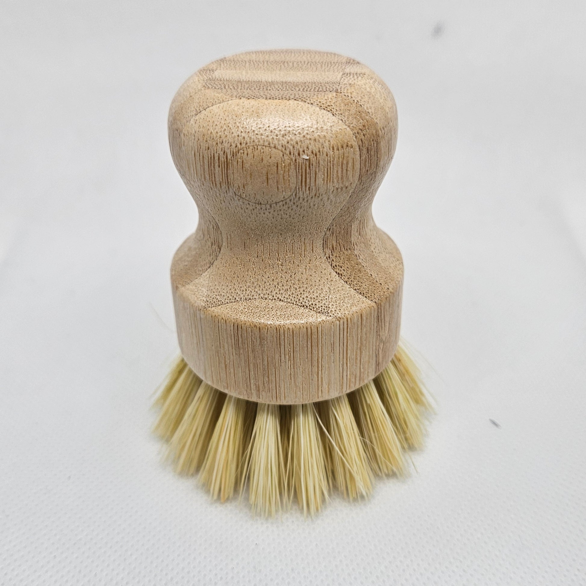 Wooden brush with bristle head on a white background