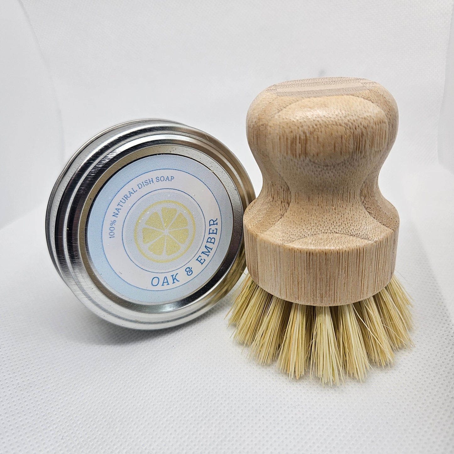 Cleaning brush with wooden handle and bristles on a white background