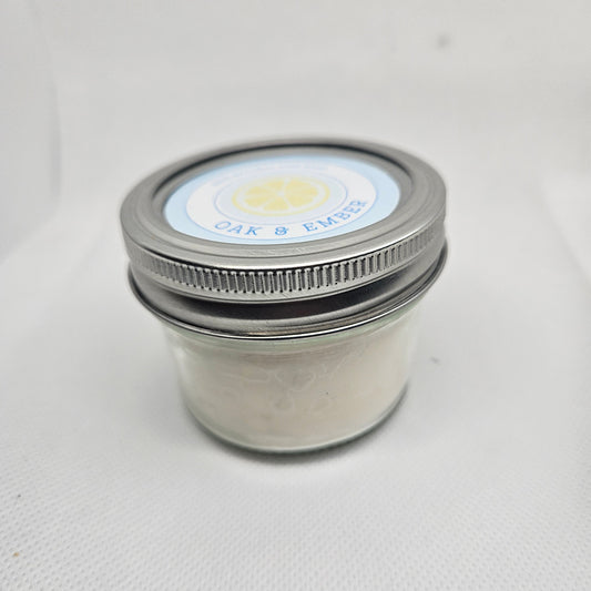 Close-up of a metal jar with a lid on a white background