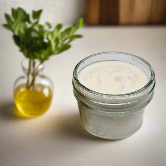 Wooden dish brush with a glass container of white powder on a light gray background